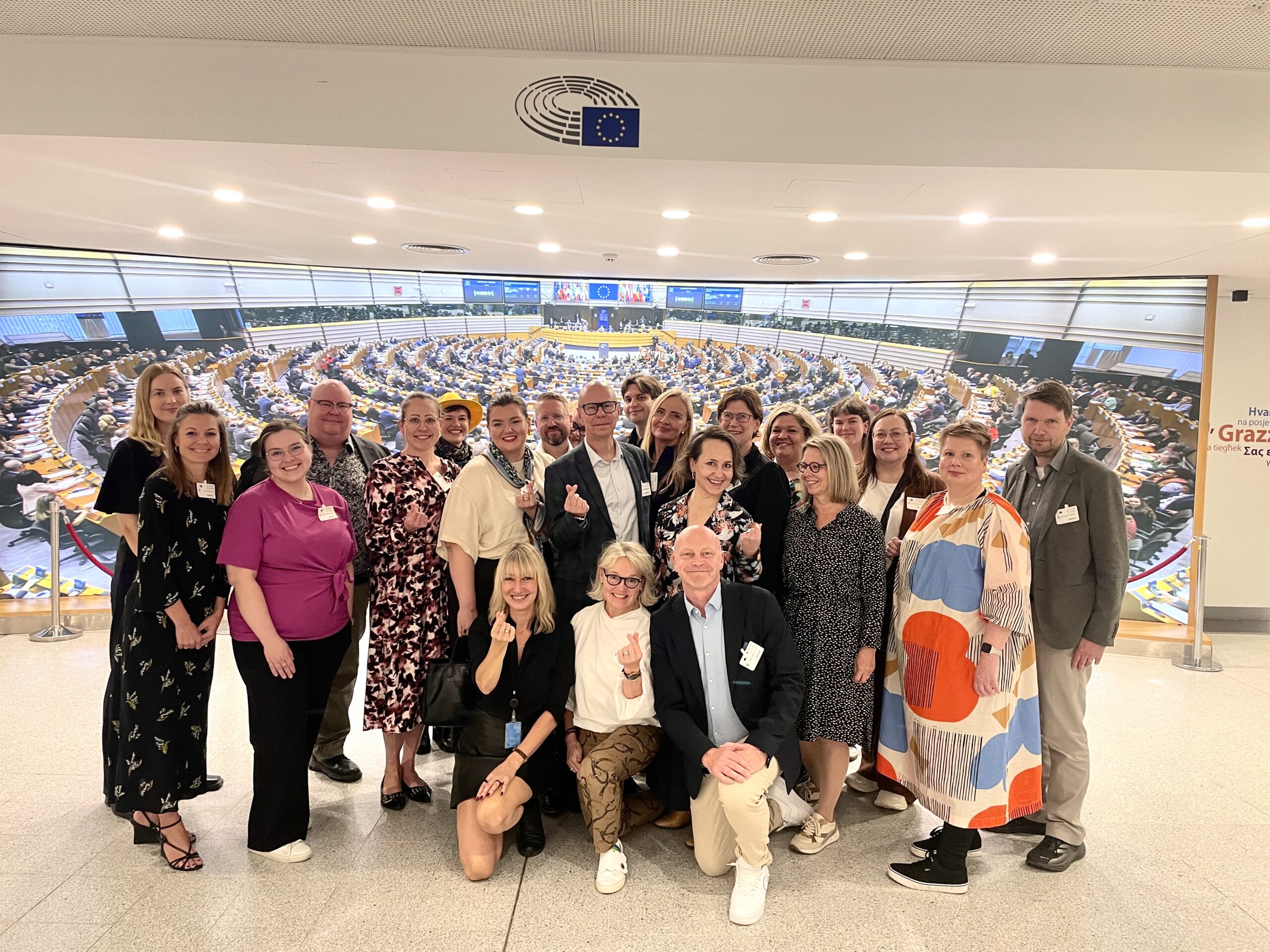 Delegation of Finnish cultural professionals at the Hemicycle of European Parliament with Member of the European Parliament Maria Guzenina